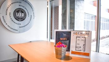 a table with a hotmail box and a newspaper on top of it